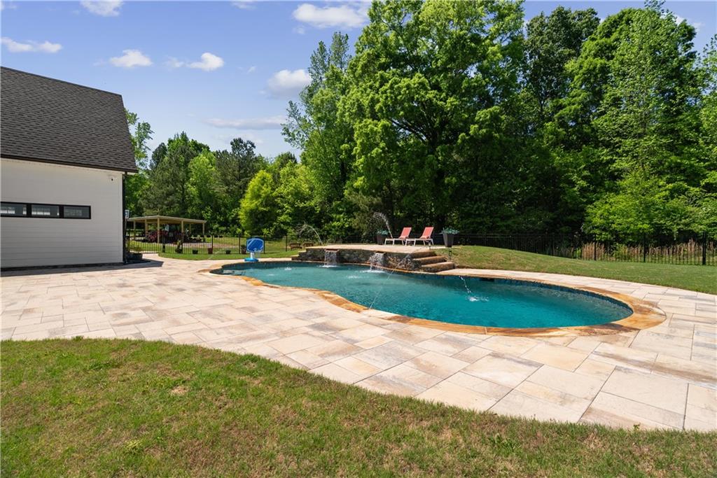 876 Cline Road Resaca, GA 30735 - Photo 42 of 57 a view of a swimming pool with a yard