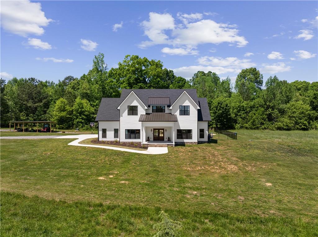 876 Cline Road Resaca, GA 30735 - Photo 54 of 57 a front view of a house with a garden
