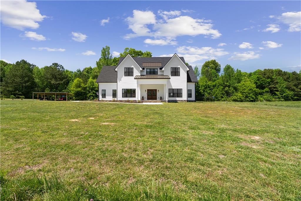 876 Cline Road Resaca, GA 30735 - Photo 55 of 57 a view of a house with a big yard and a large tree