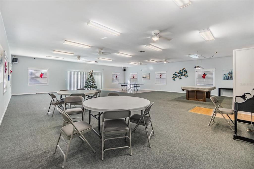 12760 Indian Rocks Road, Unit 104 Largo, FL 33774 - Photo 26 of 37 a view of a dining room with furniture and wooden floor