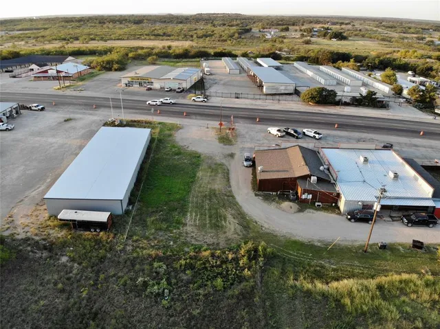 an aerial view of a house with beach