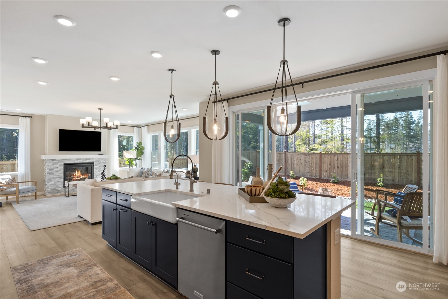 4461 Wandering Way, Unit 58 Port Orchard, WA 98367 - Photo 11 of 26 a kitchen with counter top space sink and living room view