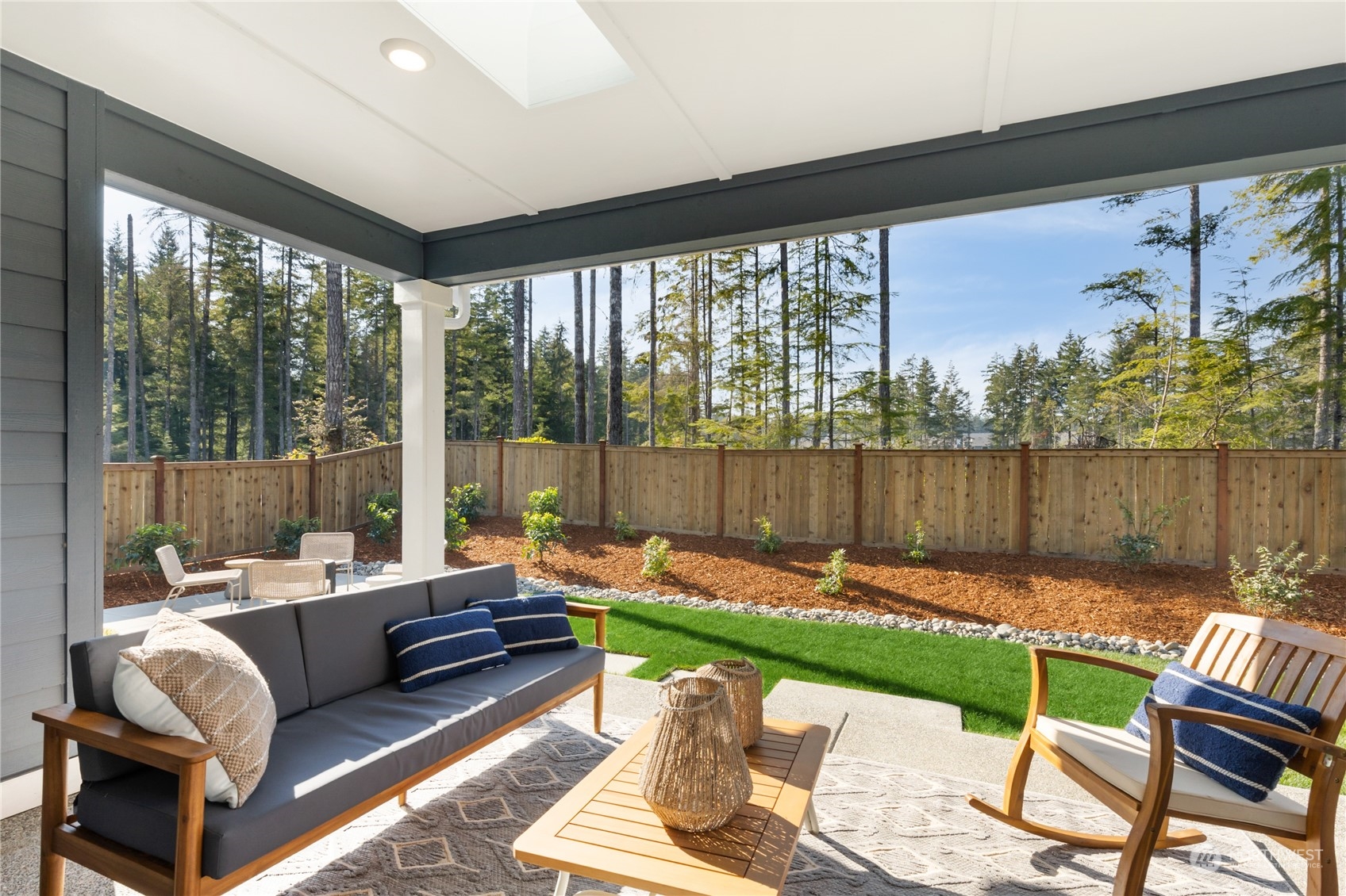 4461 Wandering Way, Unit 58 Port Orchard, WA 98367 - Photo 13 of 26 a living room with furniture and a floor to ceiling window