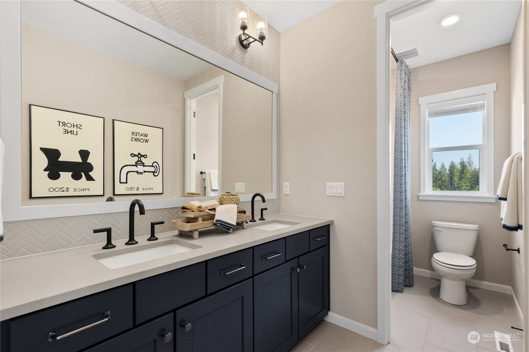 4461 Wandering Way, Unit 58 Port Orchard, WA 98367 - Photo 16 of 26 a bathroom with a double vanity sink toilet and a mirror