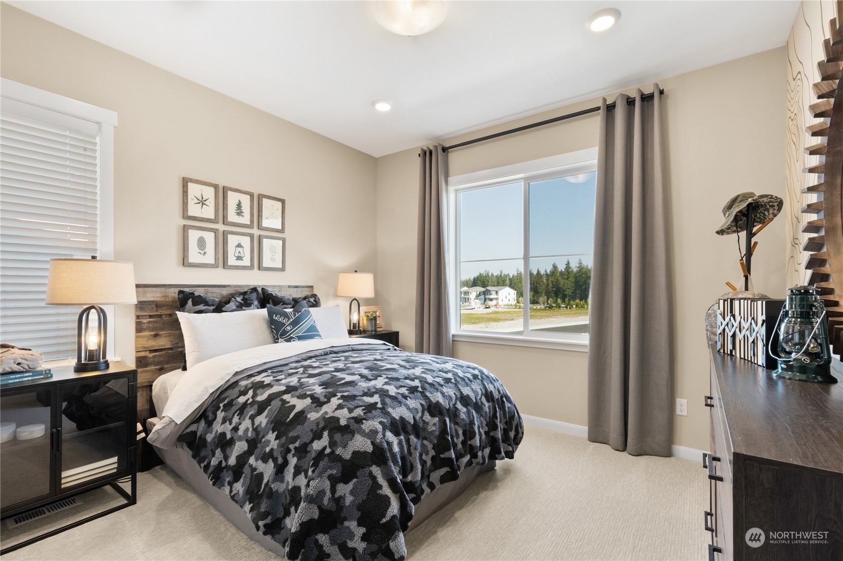 4461 Wandering Way, Unit 58 Port Orchard, WA 98367 - Photo 17 of 26 a bed sitting in a bedroom next to a window
