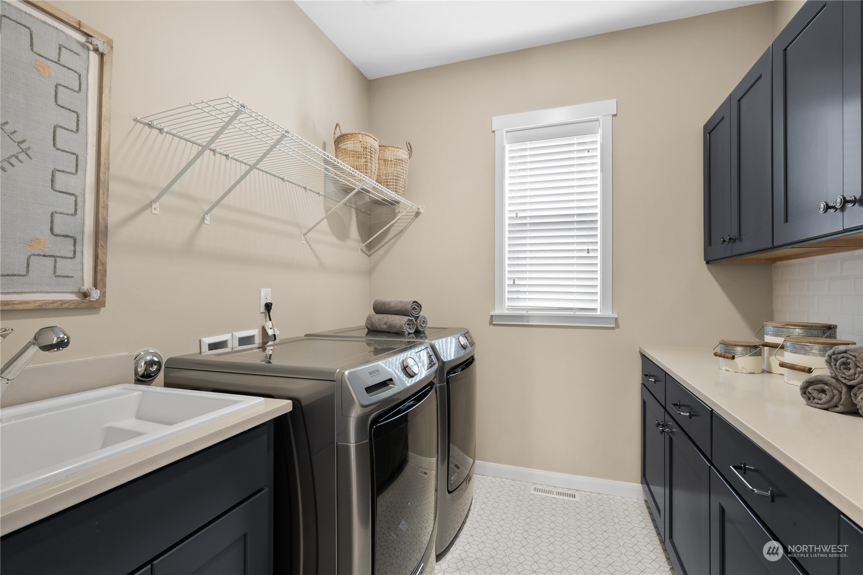 4461 Wandering Way, Unit 58 Port Orchard, WA 98367 - Photo 18 of 26 a kitchen with stainless steel appliances a sink stove and cabinets