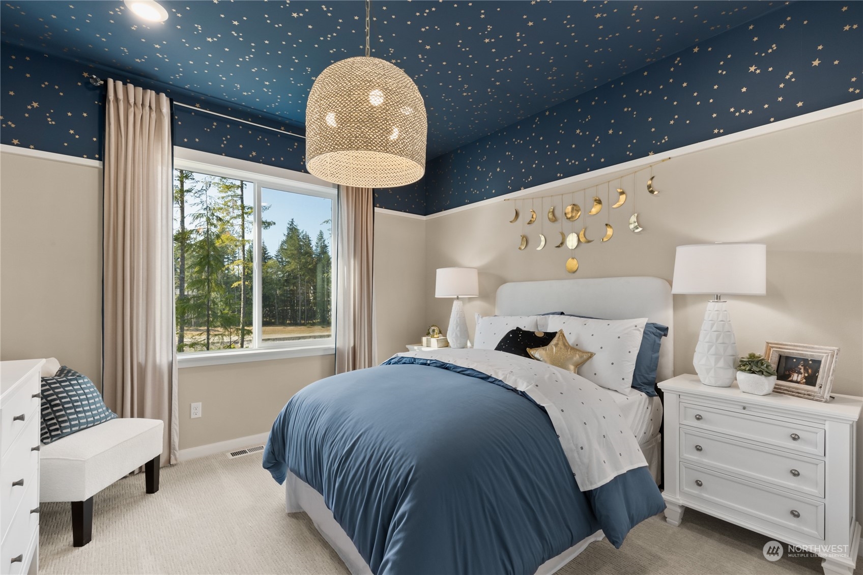 4461 Wandering Way, Unit 58 Port Orchard, WA 98367 - Photo 20 of 26 a bedroom with a large bed and a chandelier