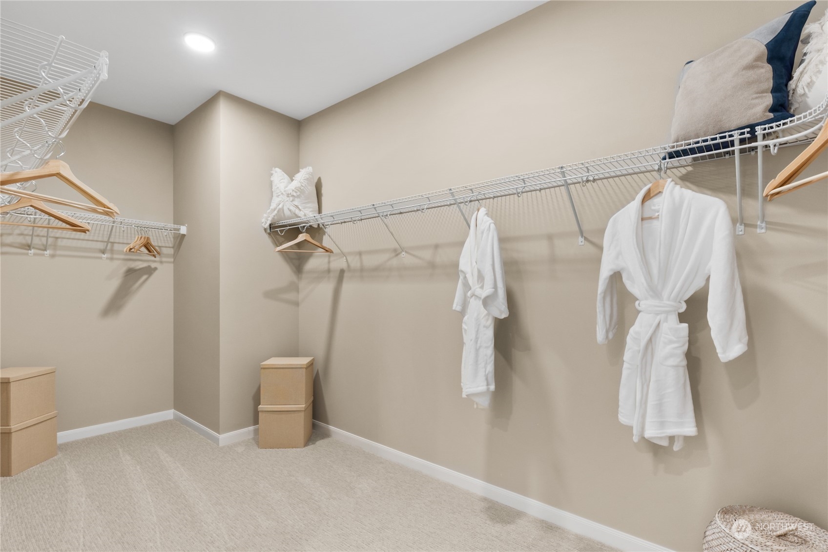 4461 Wandering Way, Unit 58 Port Orchard, WA 98367 - Photo 23 of 26 a view of walk in closet with clothes and white walls
