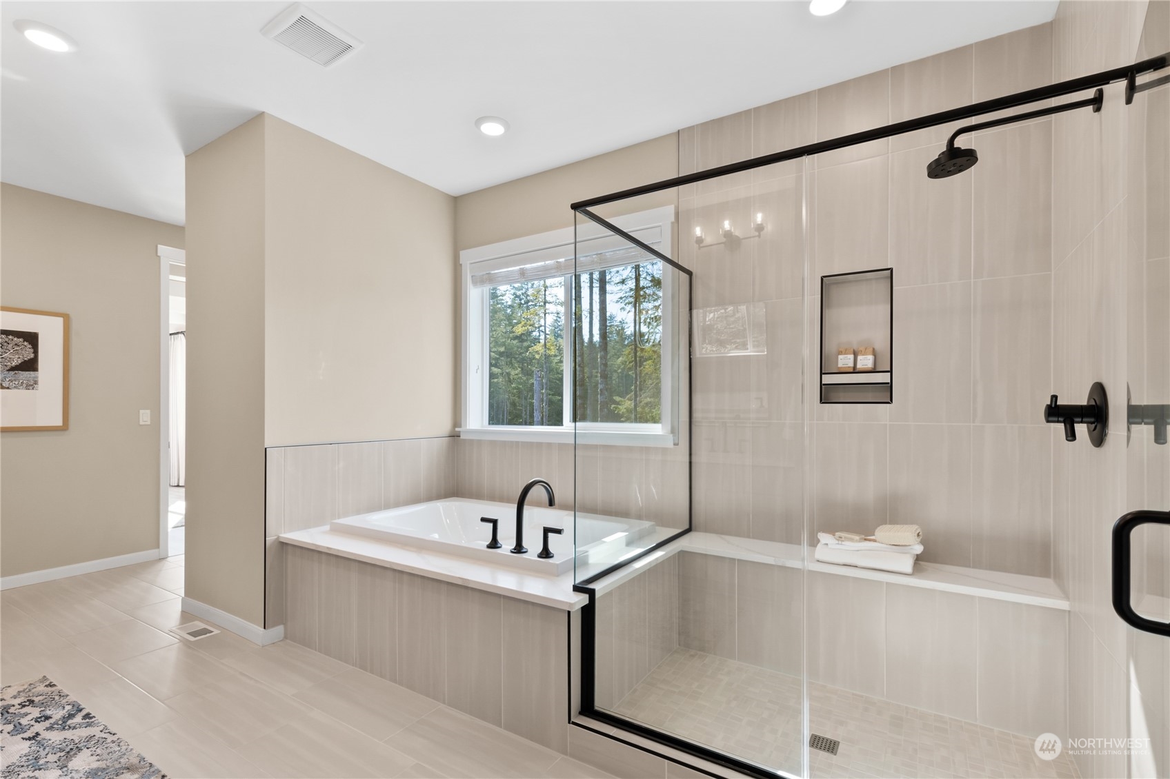 4461 Wandering Way, Unit 58 Port Orchard, WA 98367 - Photo 24 of 26 a white bath tub sitting next to a window