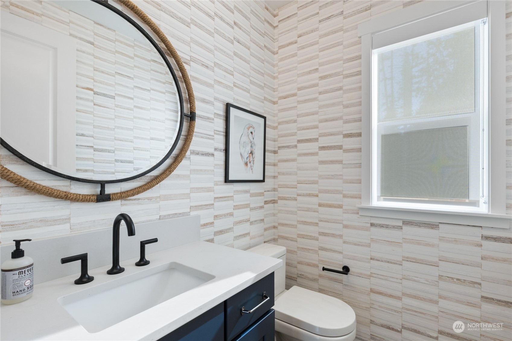 4461 Wandering Way, Unit 58 Port Orchard, WA 98367 - Photo 5 of 26 a bathroom with a toilet sink and mirror