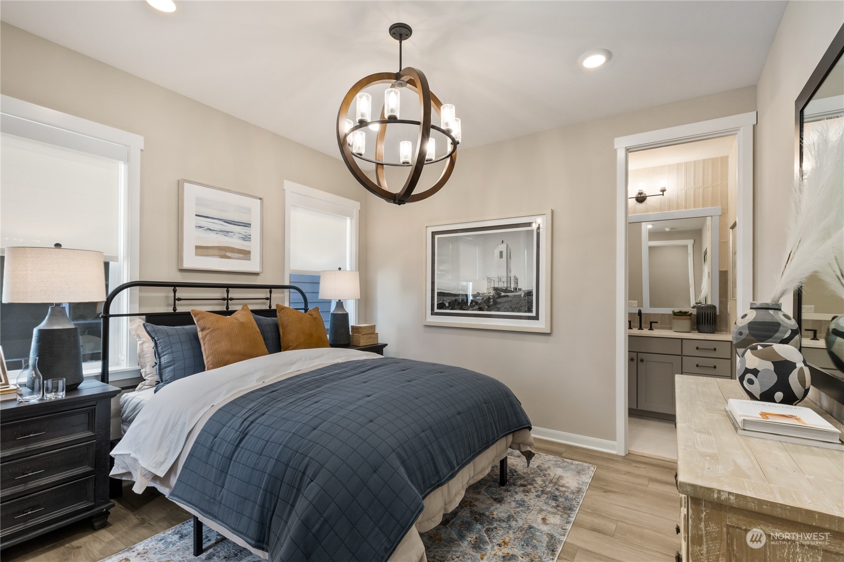 4461 Wandering Way, Unit 58 Port Orchard, WA 98367 - Photo 8 of 26 a bedroom with bed and a chandelier