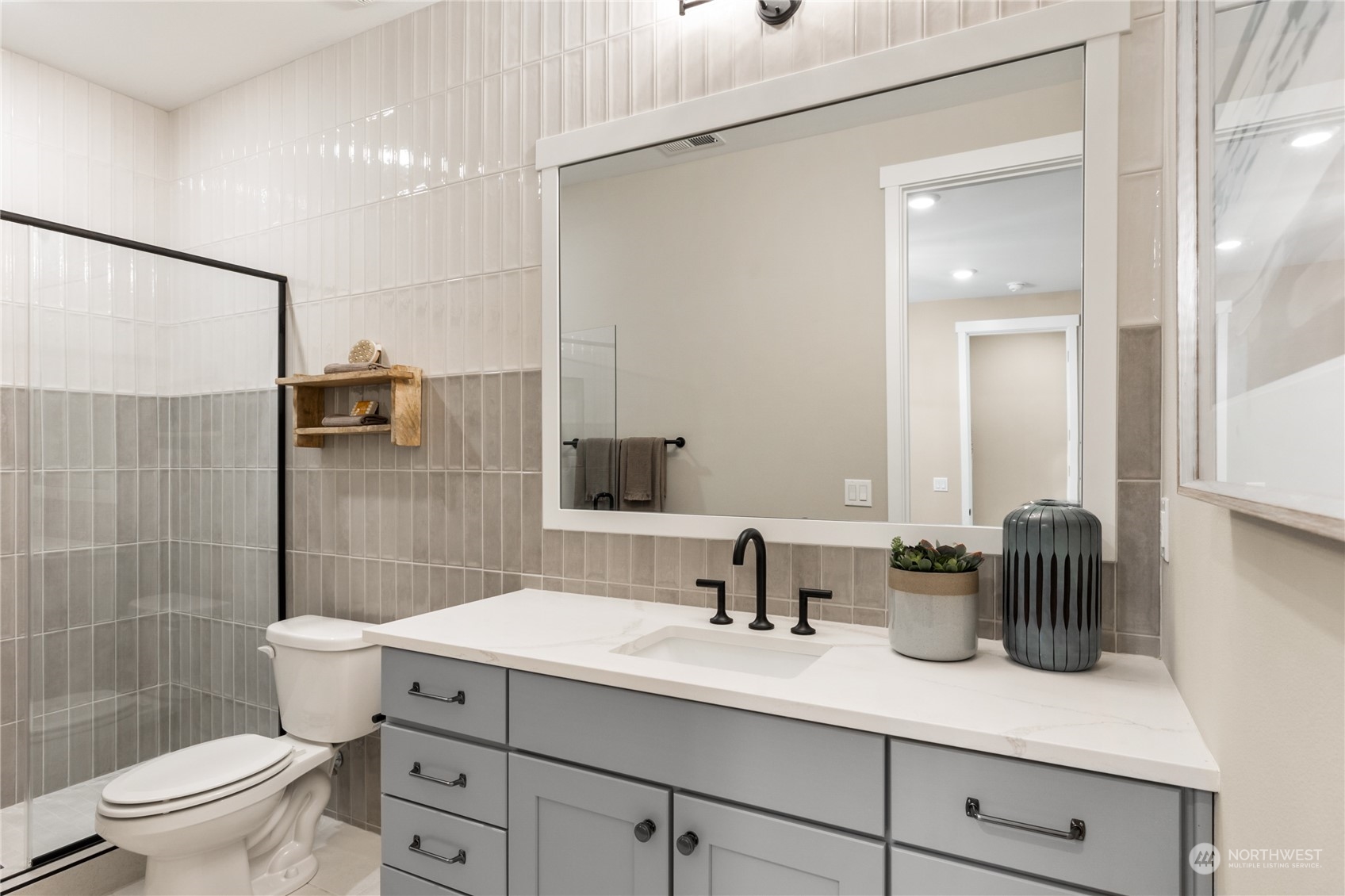 4461 Wandering Way, Unit 58 Port Orchard, WA 98367 - Photo 9 of 26 a bathroom with a double vanity sink toilet and shower