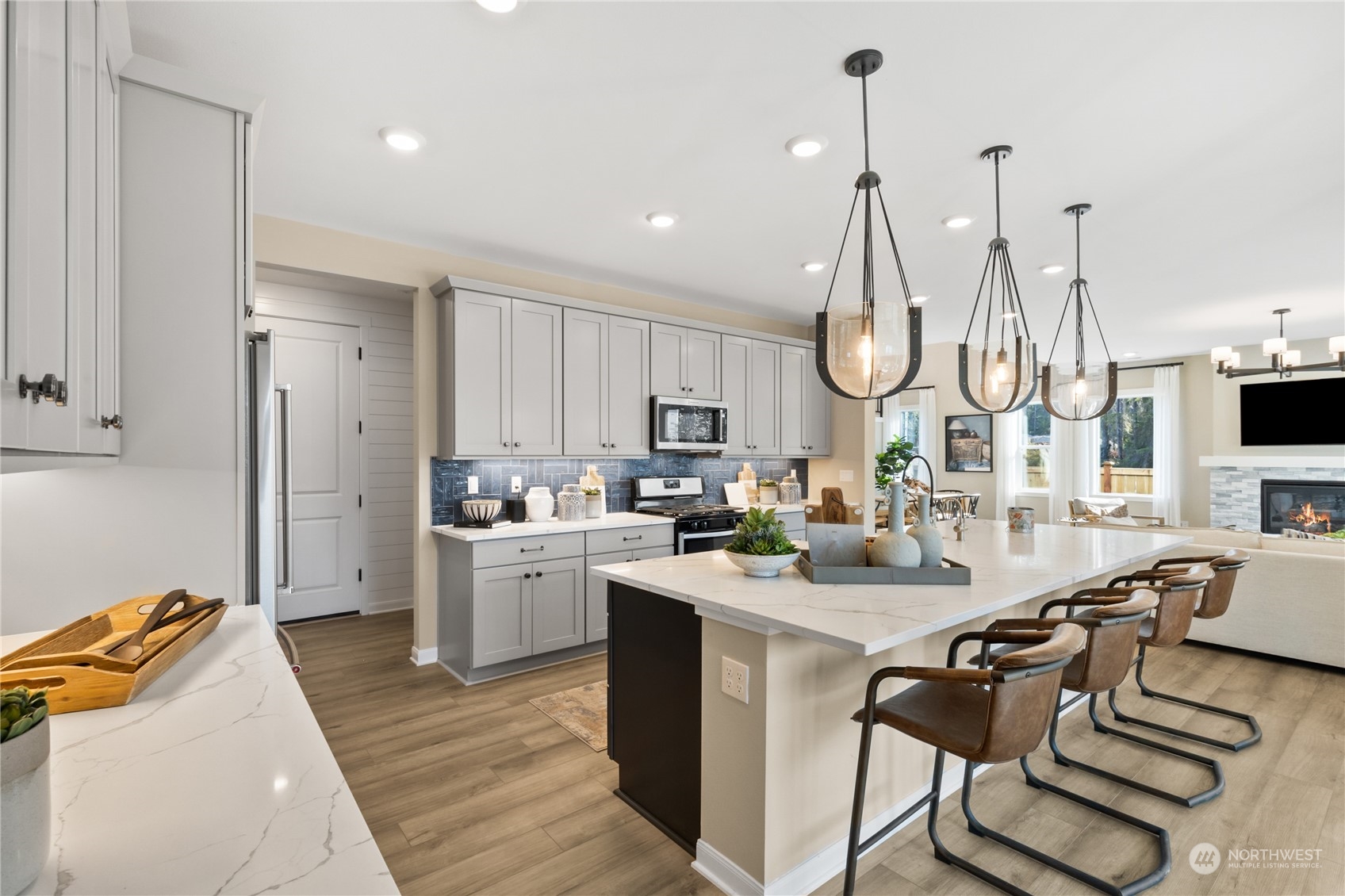 4461 Wandering Way, Unit 58 Port Orchard, WA 98367 - Photo 10 of 26 a kitchen with white cabinets and stainless steel appliances