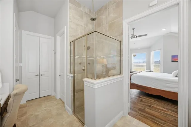 an empty room with a white cabinet and mirrors