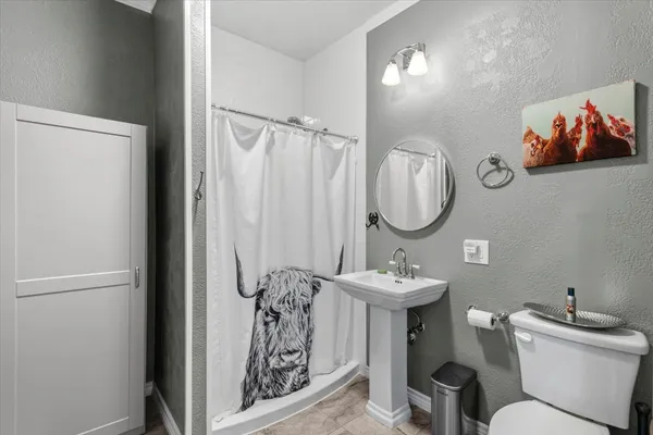 a utility room with sink dryer and washer