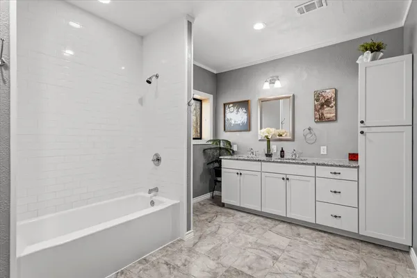 a bathroom with a granite countertop sink mirror and a
