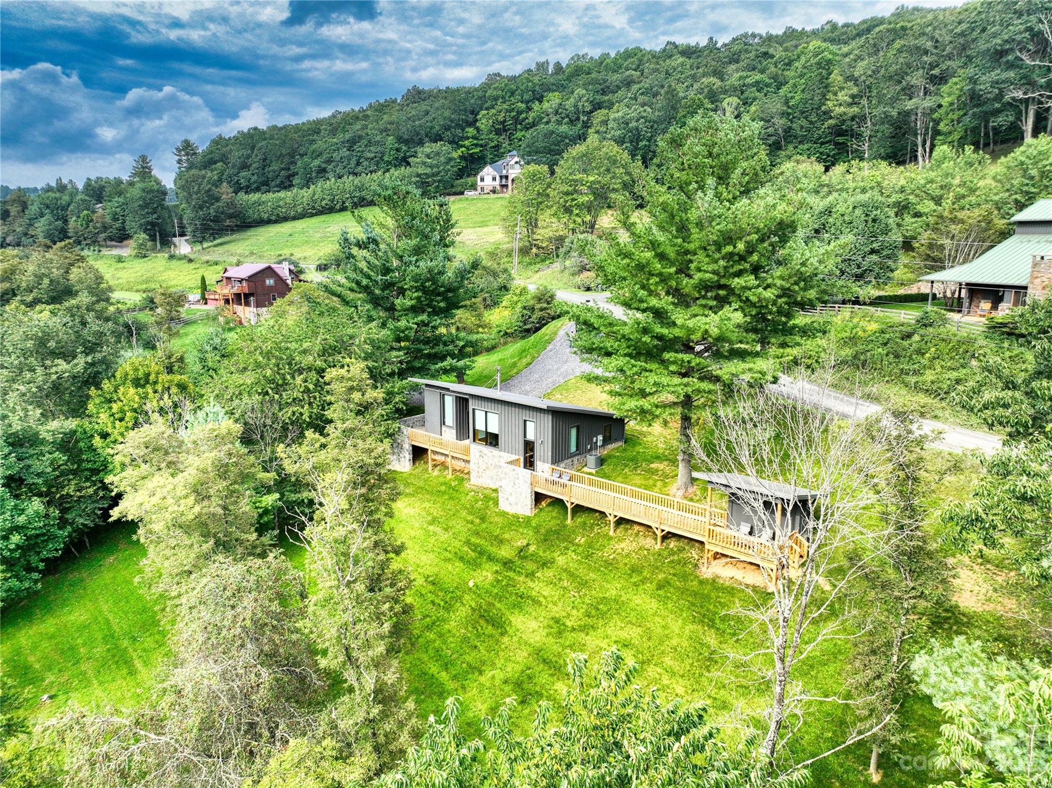 3765 Bald Mountain Road, Unit 2 West Jefferson, NC 28694 - Photo 1 of 35 an aerial view of residential house with an outdoor space and seating