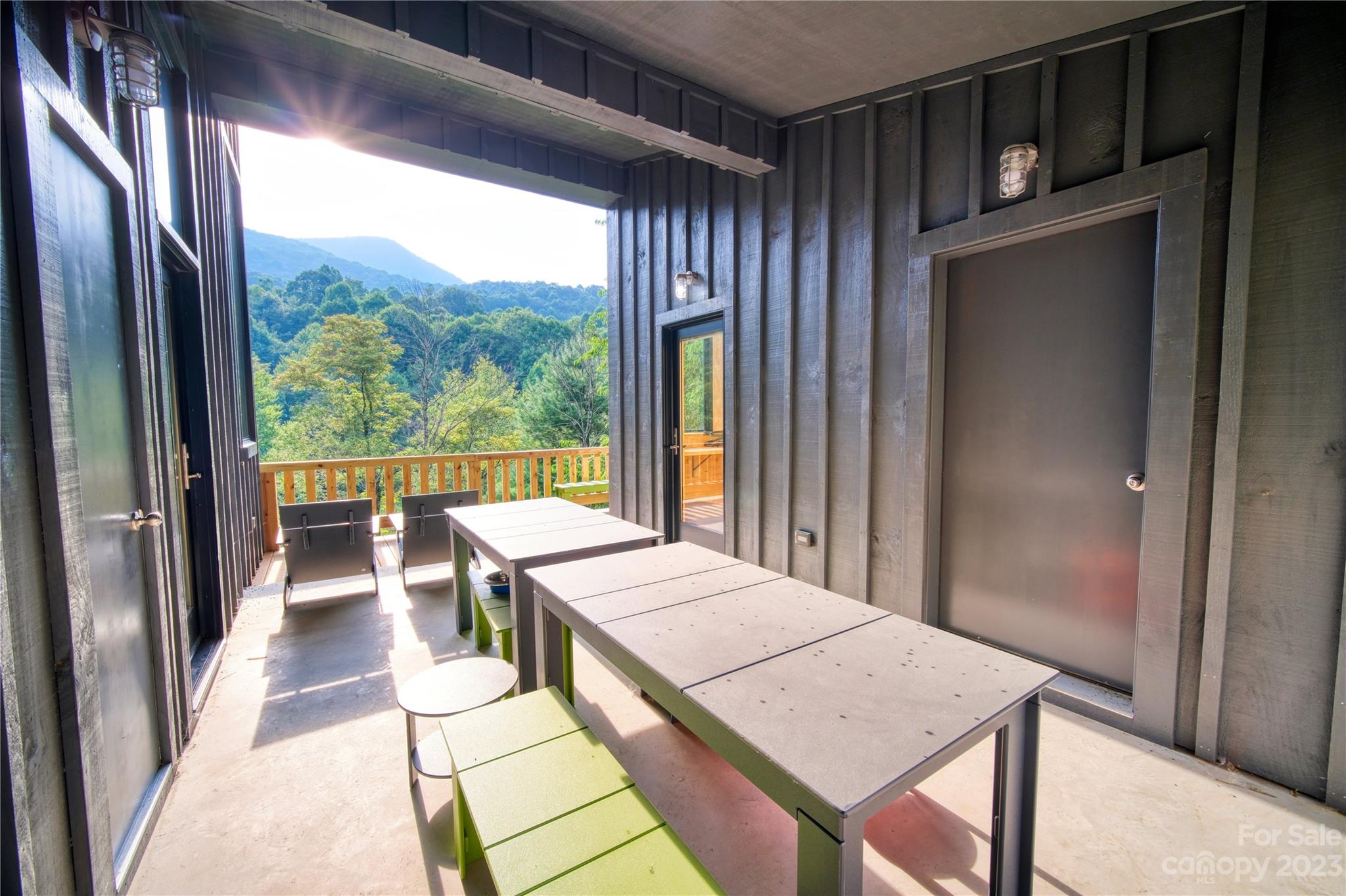 3765 Bald Mountain Road, Unit 2 West Jefferson, NC 28694 - Photo 16 of 35 a view of a balcony and chairs
