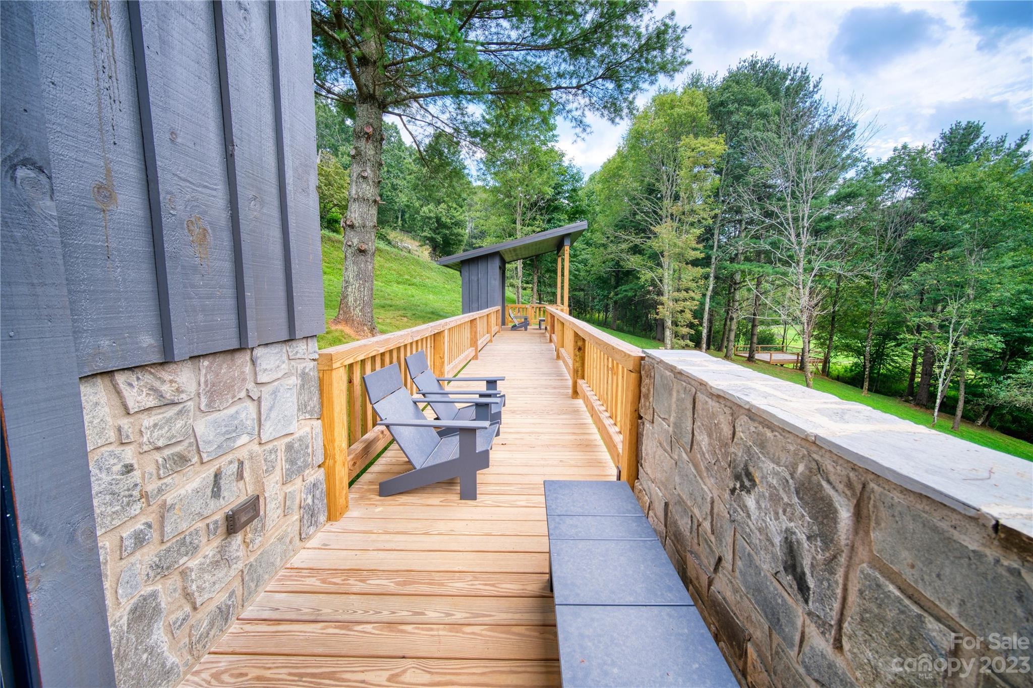 3765 Bald Mountain Road, Unit 2 West Jefferson, NC 28694 - Photo 26 of 35 a view of balcony with wooden floor and outdoor seating