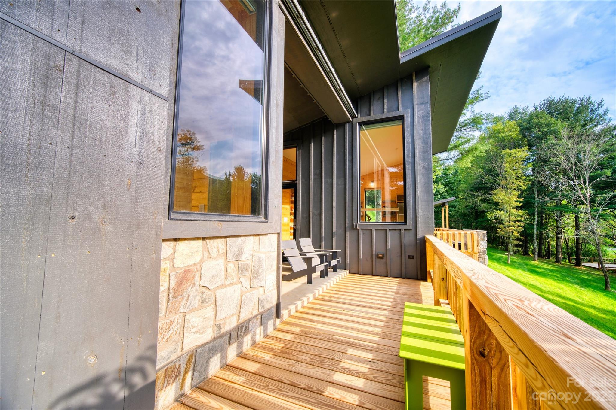 3765 Bald Mountain Road, Unit 2 West Jefferson, NC 28694 - Photo 28 of 35 a view of an outdoor dining space with a backyard