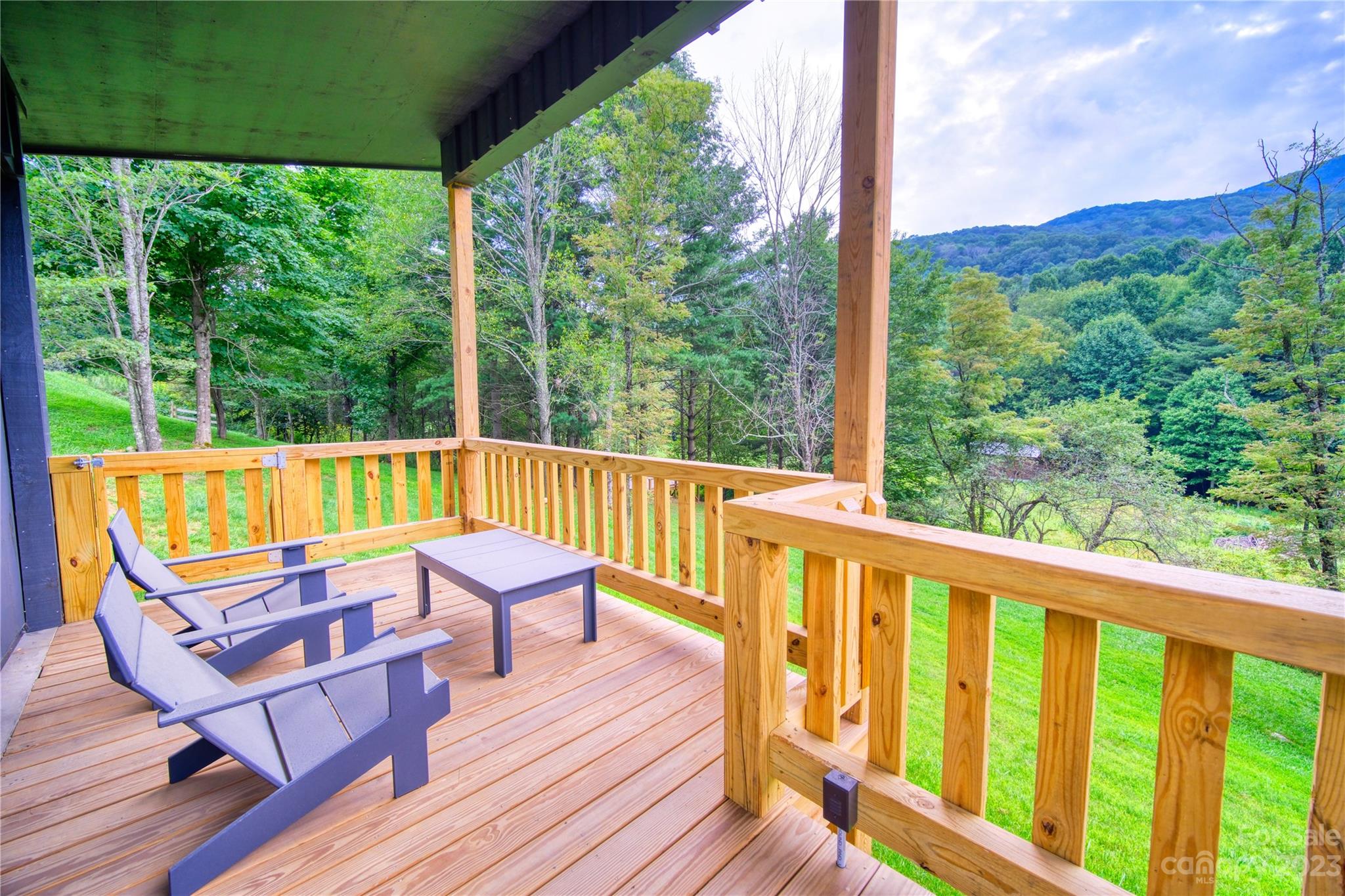 3765 Bald Mountain Road, Unit 2 West Jefferson, NC 28694 - Photo 3 of 35 a view of a two chairs in the deck