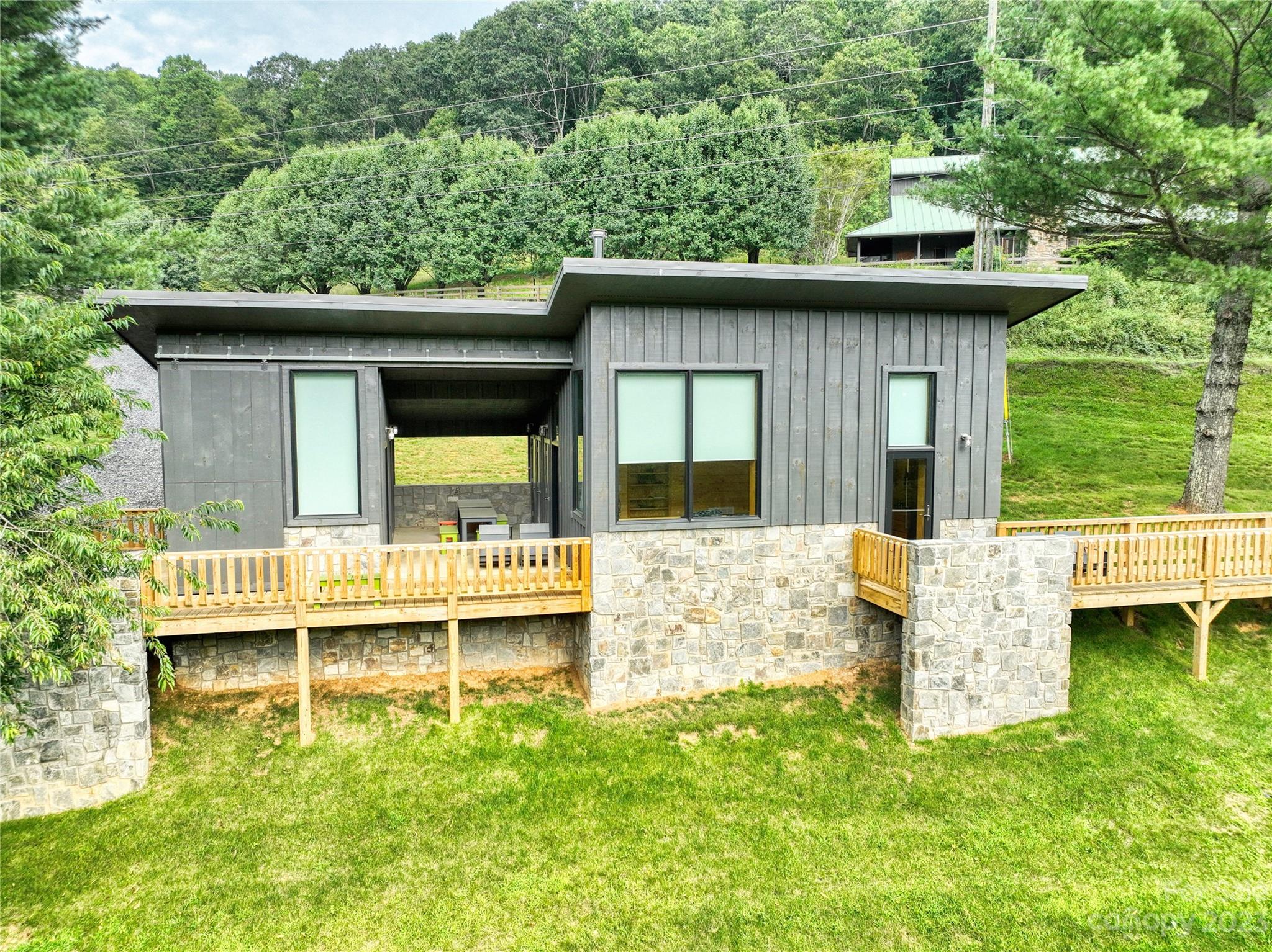 3765 Bald Mountain Road, Unit 2 West Jefferson, NC 28694 - Photo 5 of 35 a view of a house with a yard