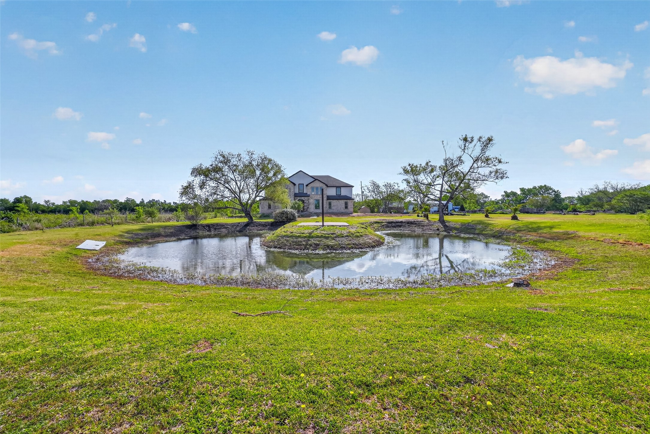 8023 Pool Hill Road Fulshear, TX 77441 - Photo 46 of 50 a view of a swimming pool with an ocean view