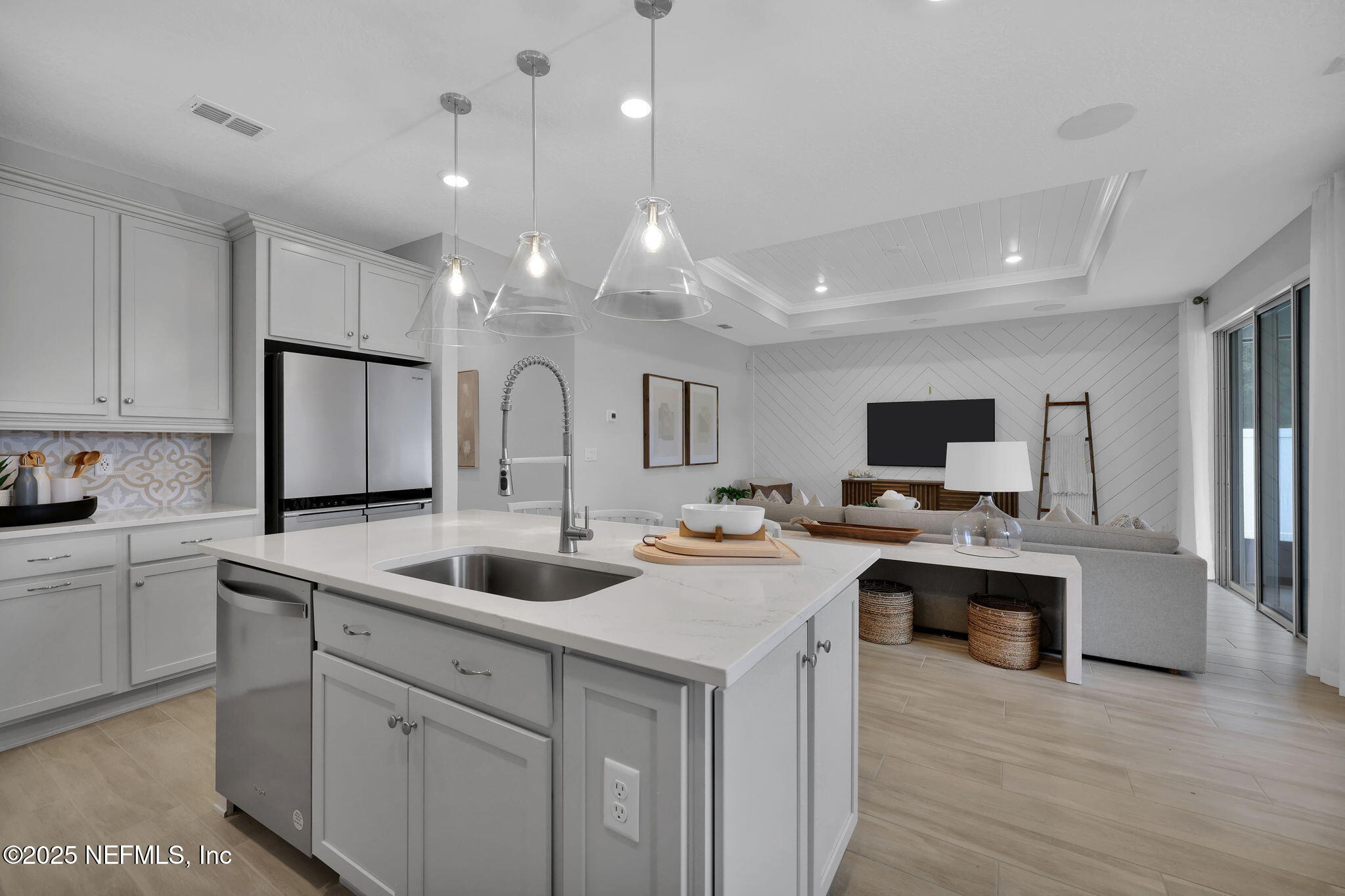 1710 Mickey Way Middleburg, FL 32068 - Photo 8 of 20 a kitchen with kitchen island a sink appliances and cabinets