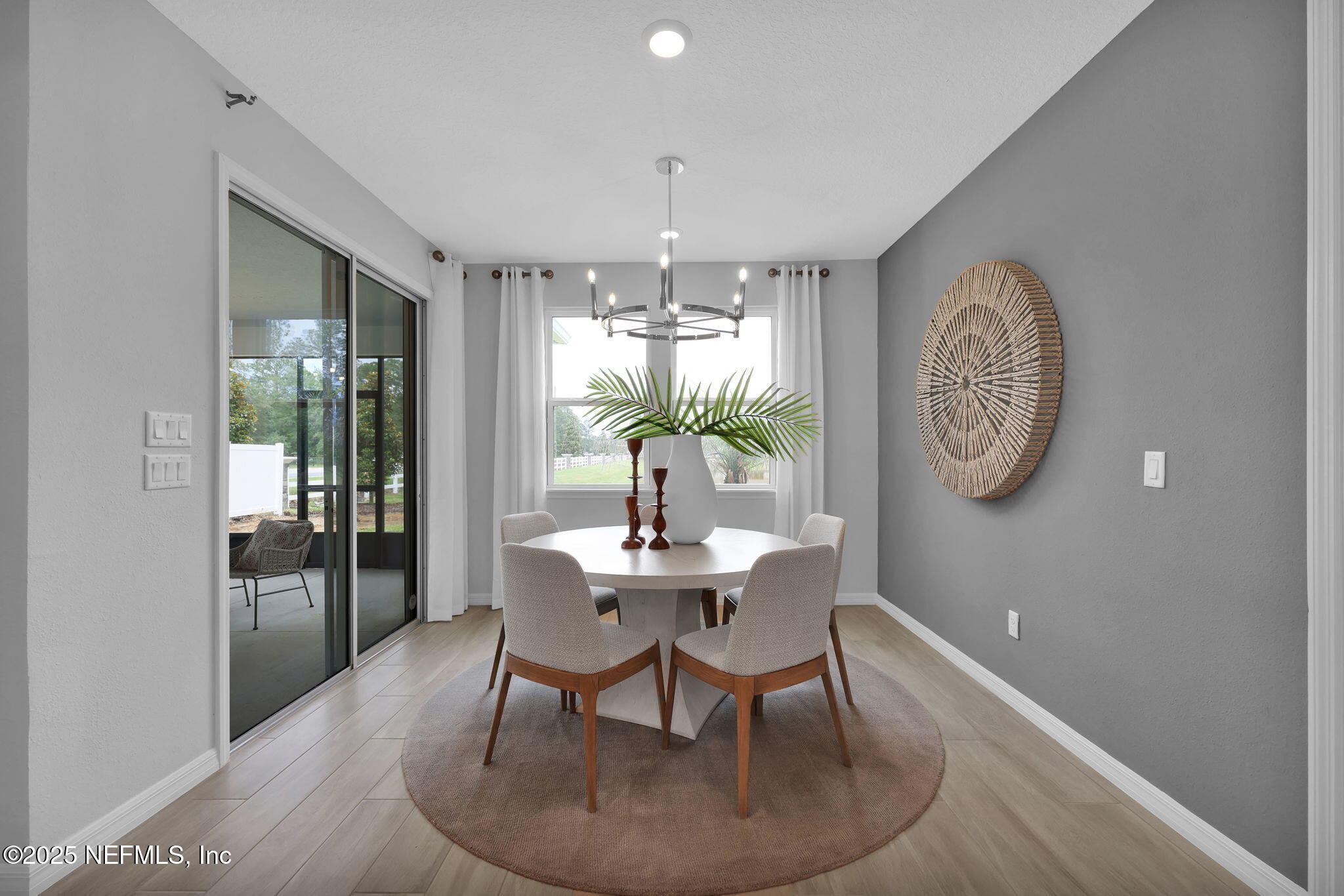 1710 Mickey Way Middleburg, FL 32068 - Photo 9 of 20 a dining room with furniture a chandelier and wooden floor