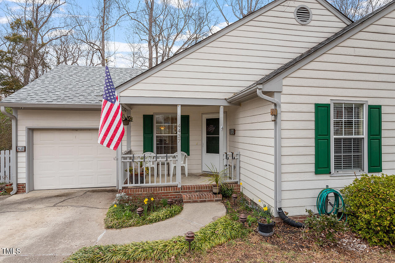 4437 Labrador Drive Raleigh, NC 27616 - Photo 1 of 25 a front view of a house with garden