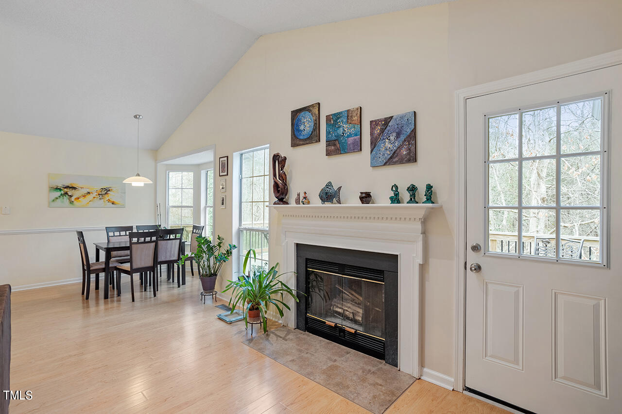 4437 Labrador Drive Raleigh, NC 27616 - Photo 11 of 25 a living room with furniture and a fireplace