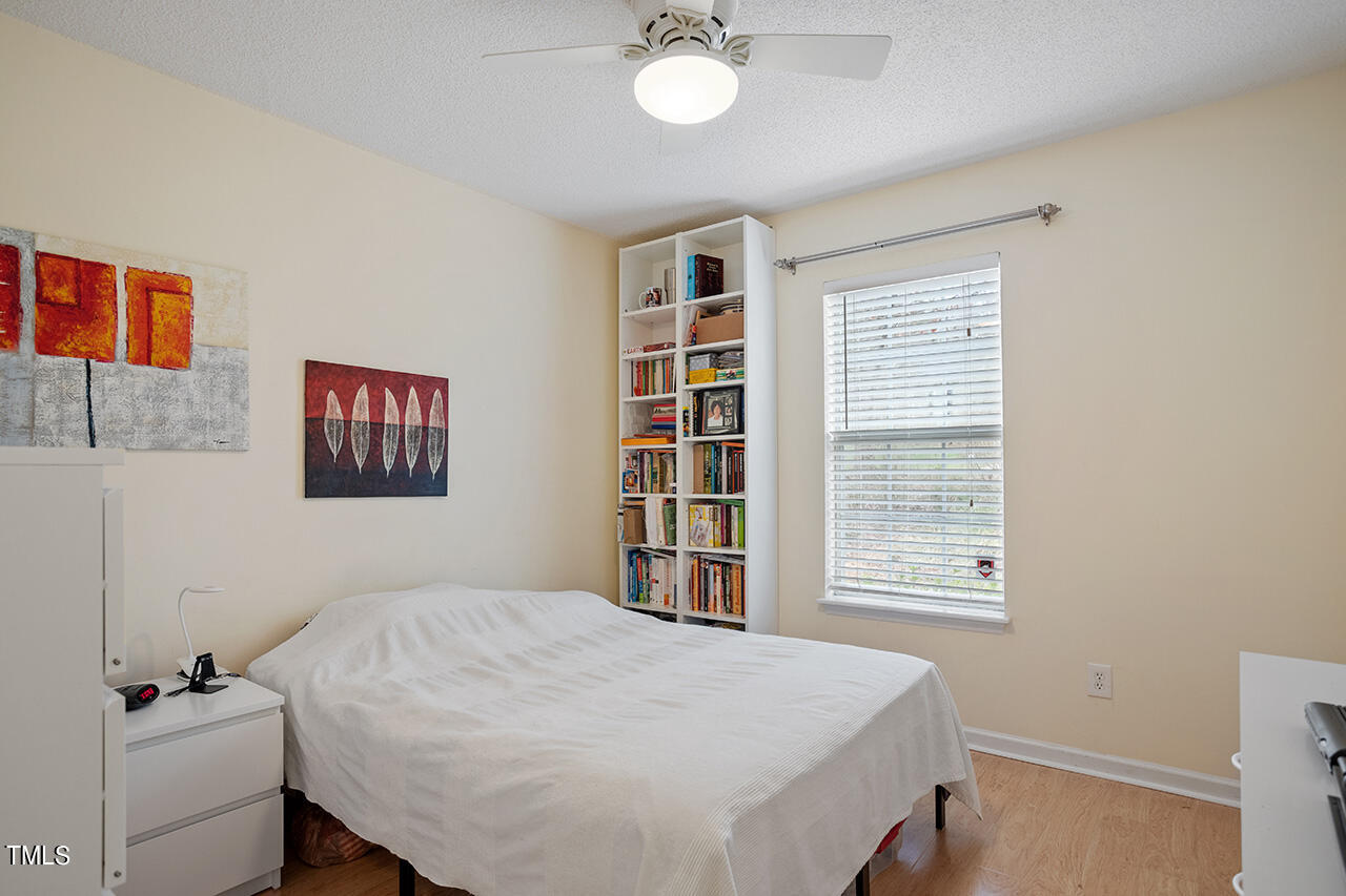 4437 Labrador Drive Raleigh, NC 27616 - Photo 23 of 25 a bedroom with a bed and a window