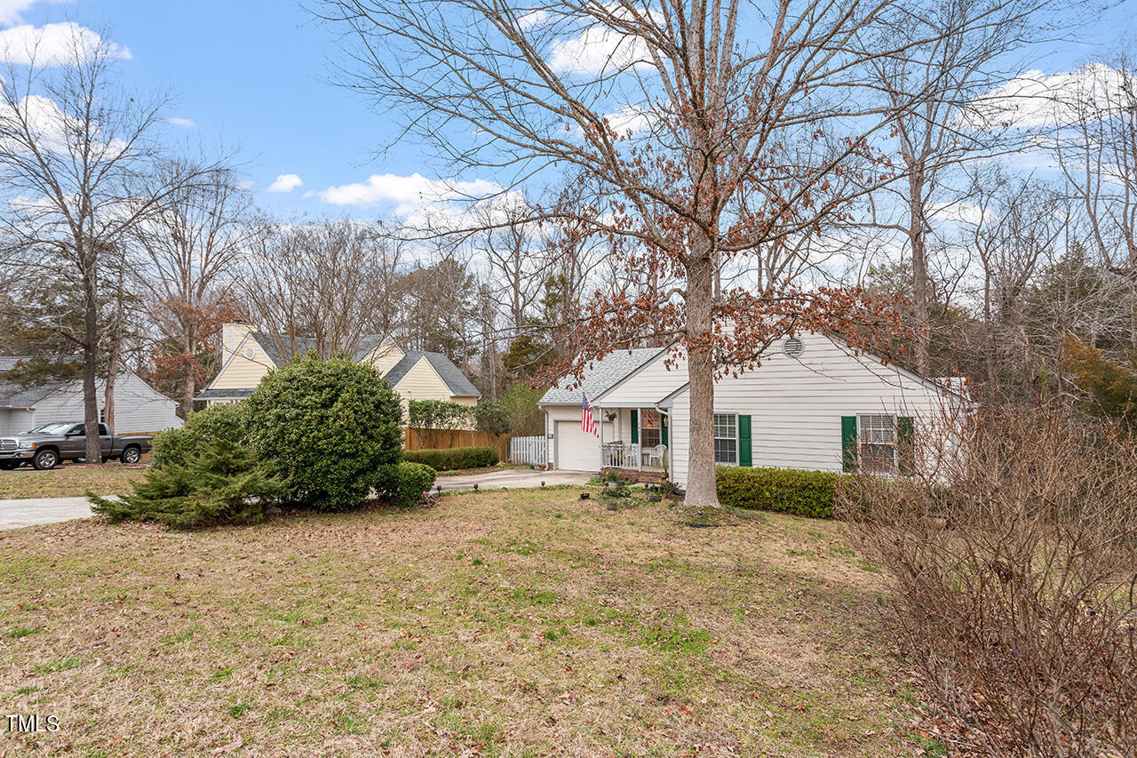 4437 Labrador Drive Raleigh, NC 27616 - Photo 3 of 25 a view of a house with a yard covered in snow