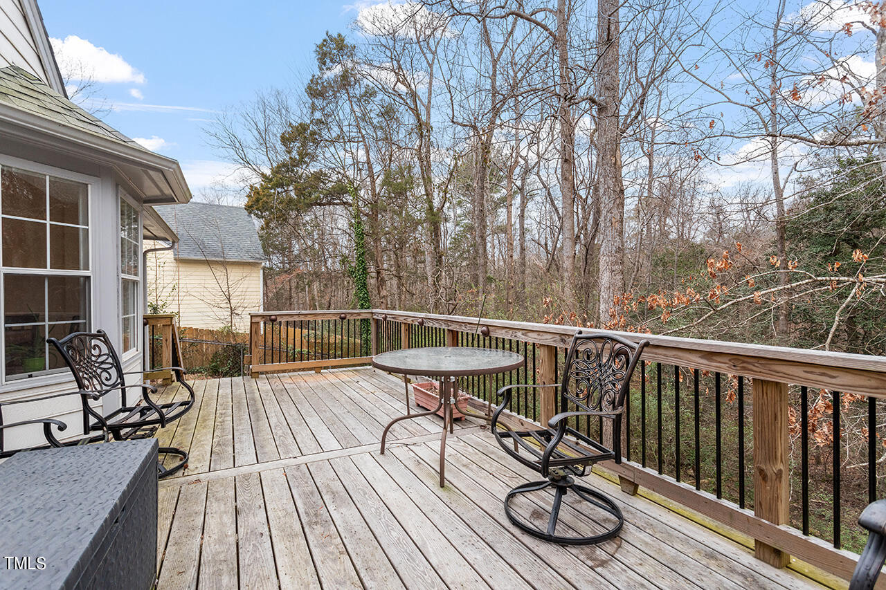 4437 Labrador Drive Raleigh, NC 27616 - Photo 4 of 25 a view of balcony with furniture and wooden floor