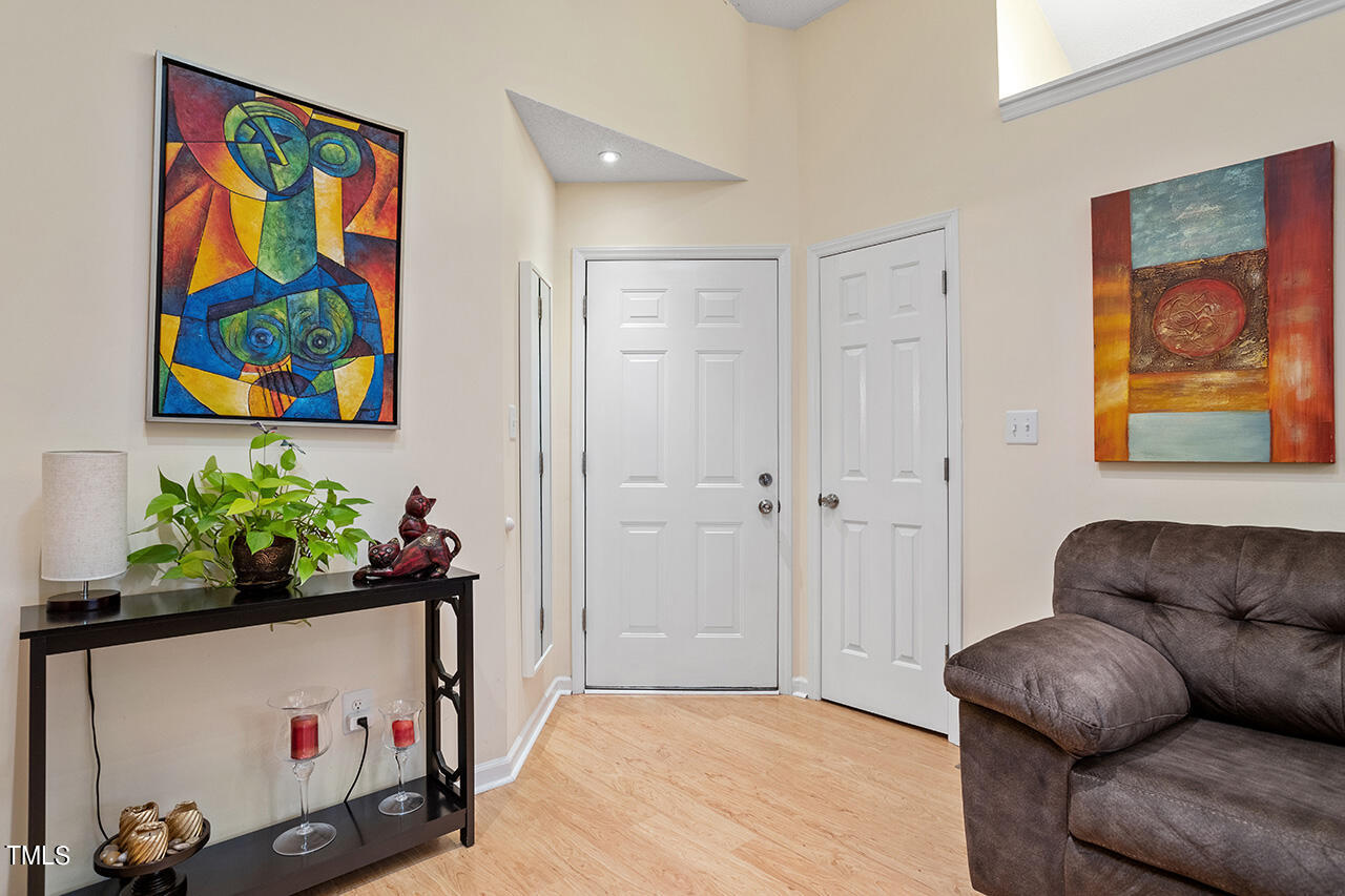 4437 Labrador Drive Raleigh, NC 27616 - Photo 7 of 25 a living room with furniture and flowers