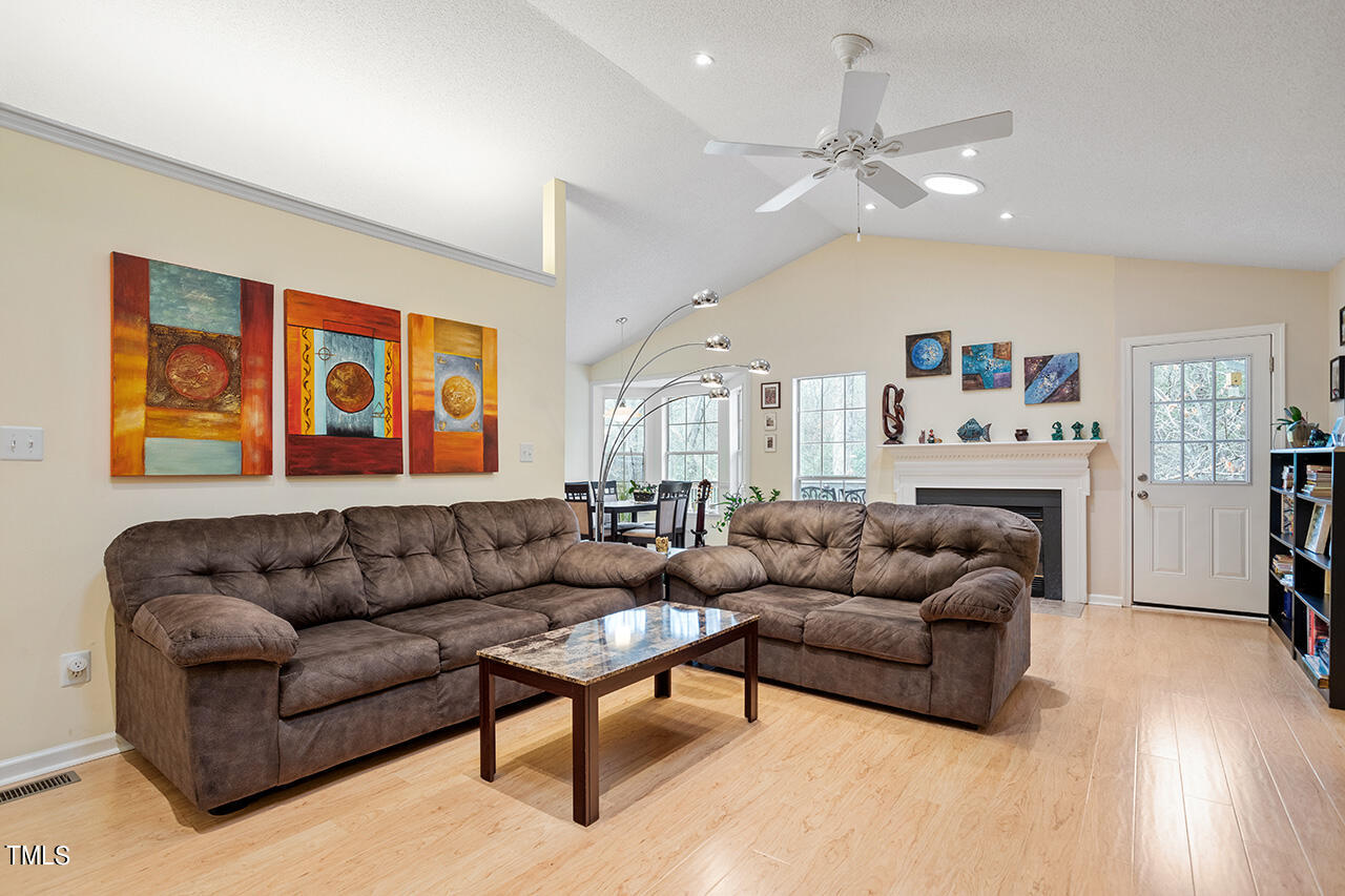 4437 Labrador Drive Raleigh, NC 27616 - Photo 8 of 25 a living room with furniture and a ceiling fan