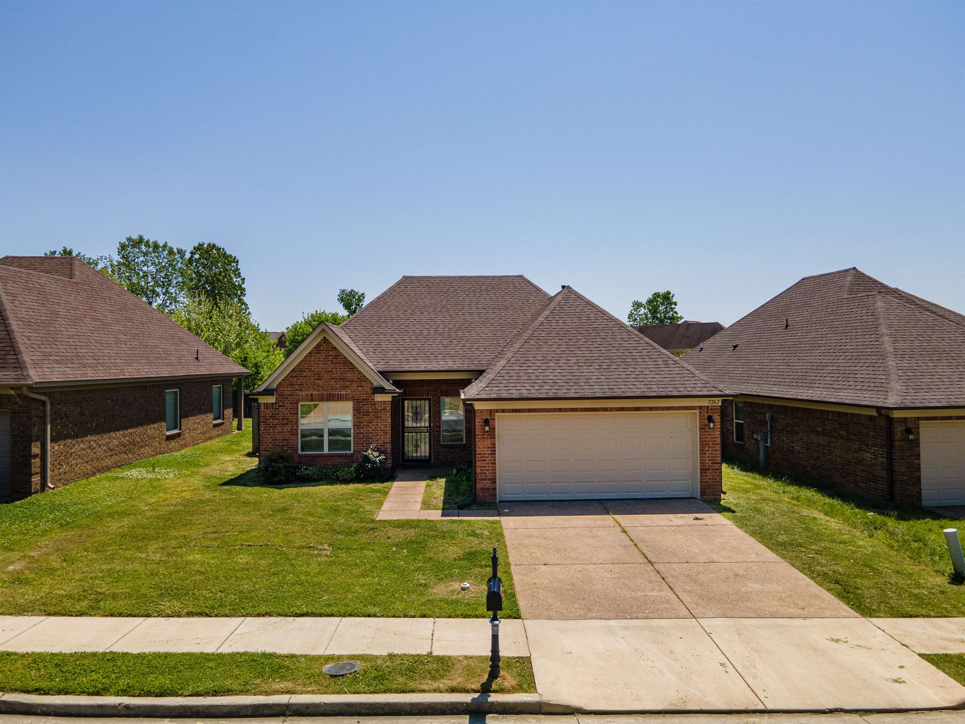 5262 Crossfield Road Memphis, TN 38109 - Photo 1 of 19 a front view of a house with a yard