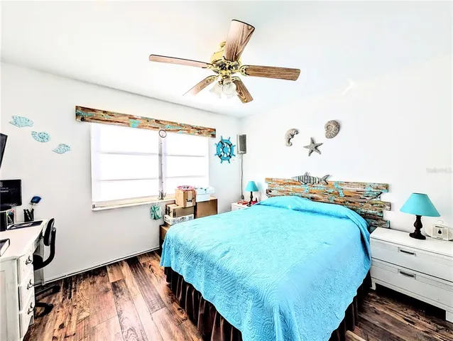 a bed room with a bed and a window