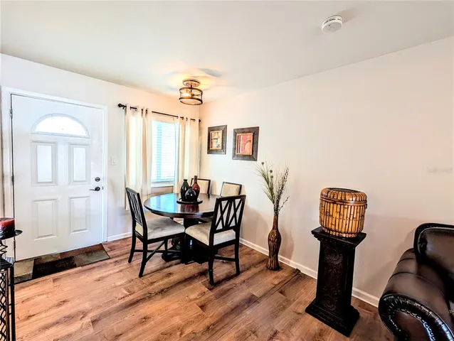 a view of a livingroom with furniture and wooden floor