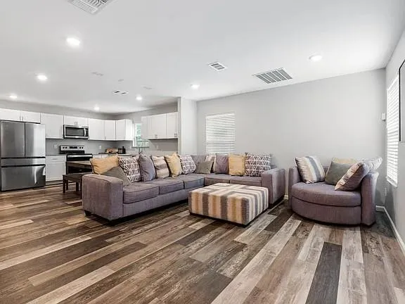 a living room with furniture and a table