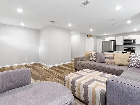 a bedroom with a bed and a couch