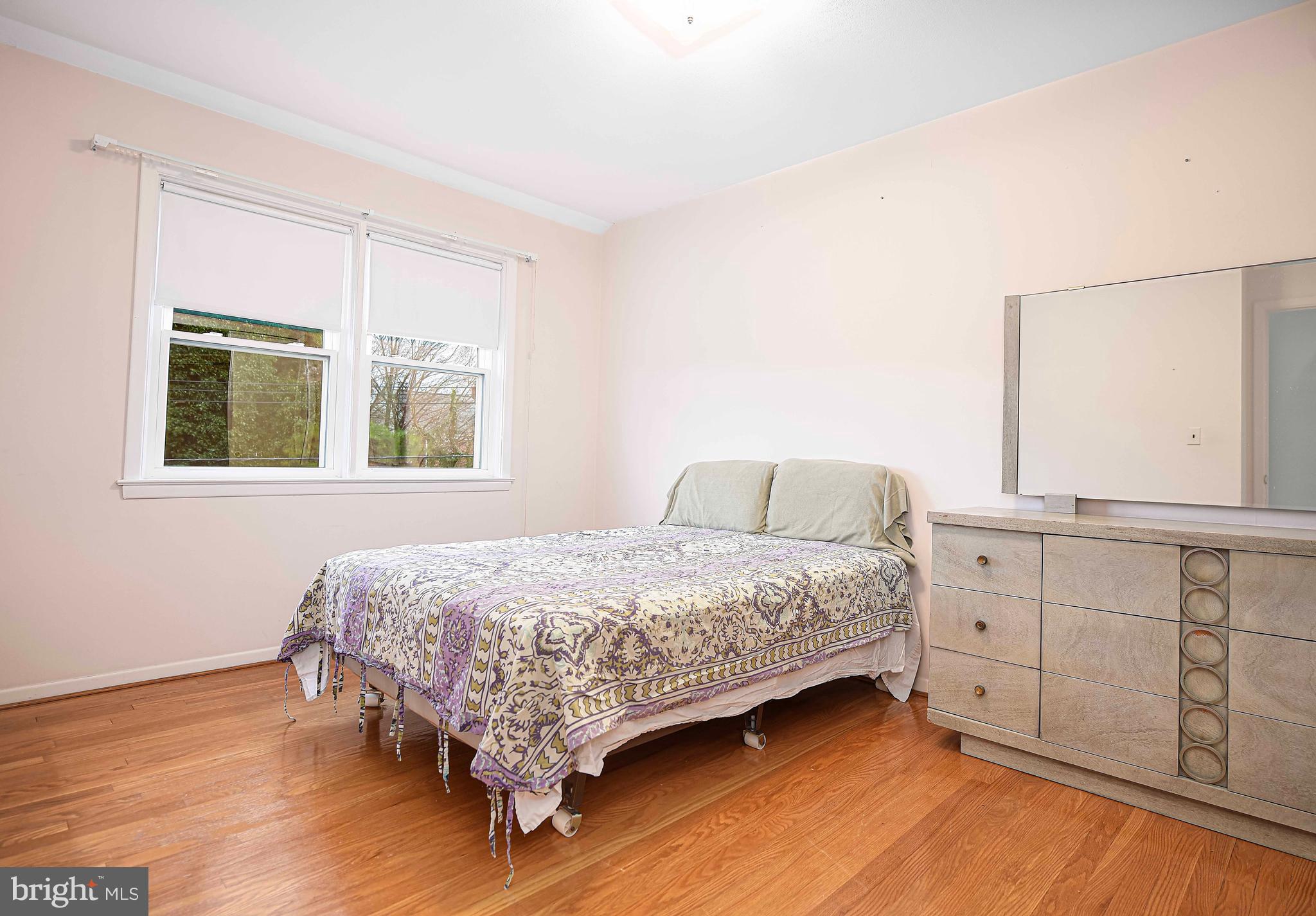1131 Hollen Road Baltimore, MD 21239 - Photo 20 of 34 a bedroom with a bed and a window