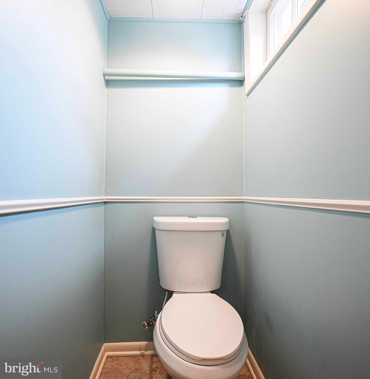 1131 Hollen Road Baltimore, MD 21239 - Photo 29 of 34 a white toilet sitting next to a shower