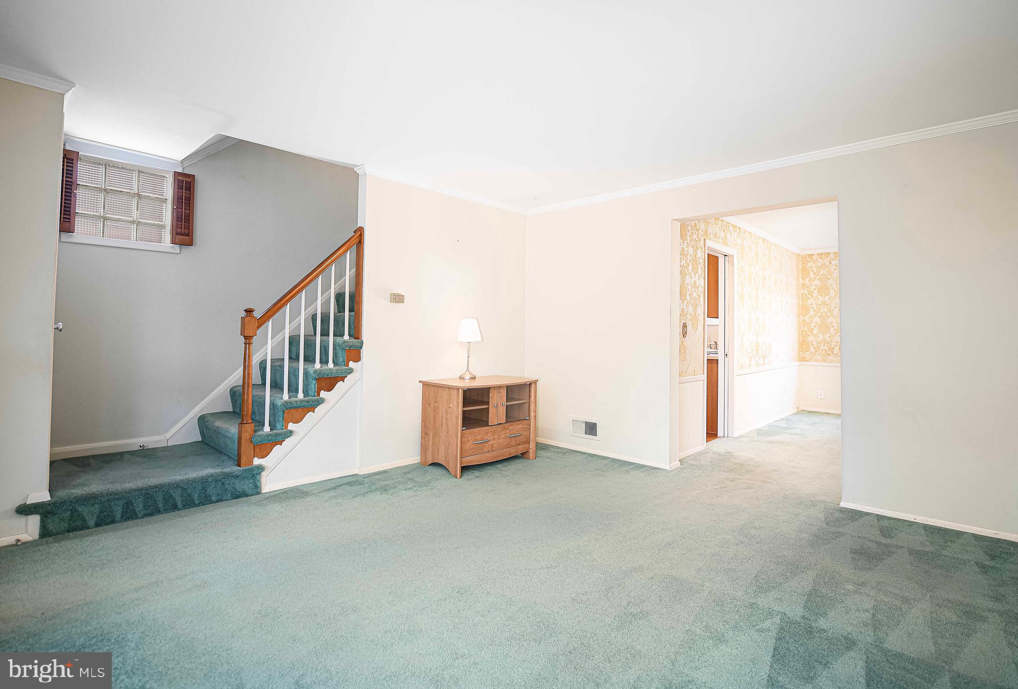 1131 Hollen Road Baltimore, MD 21239 - Photo 9 of 34 a view of an empty room with stairs