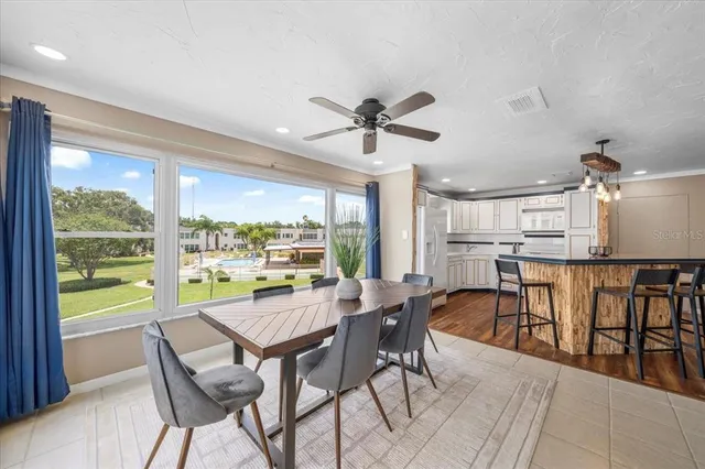 a view of a dining room with furniture window and outside view