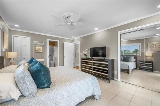 a spacious bedroom with a bed and furniture