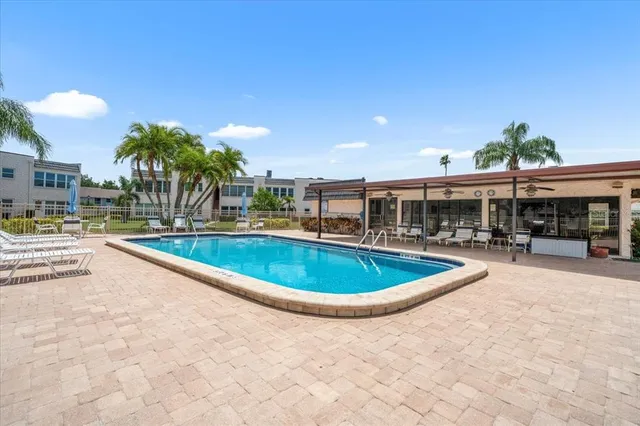 a view of a swimming pool and a chairs