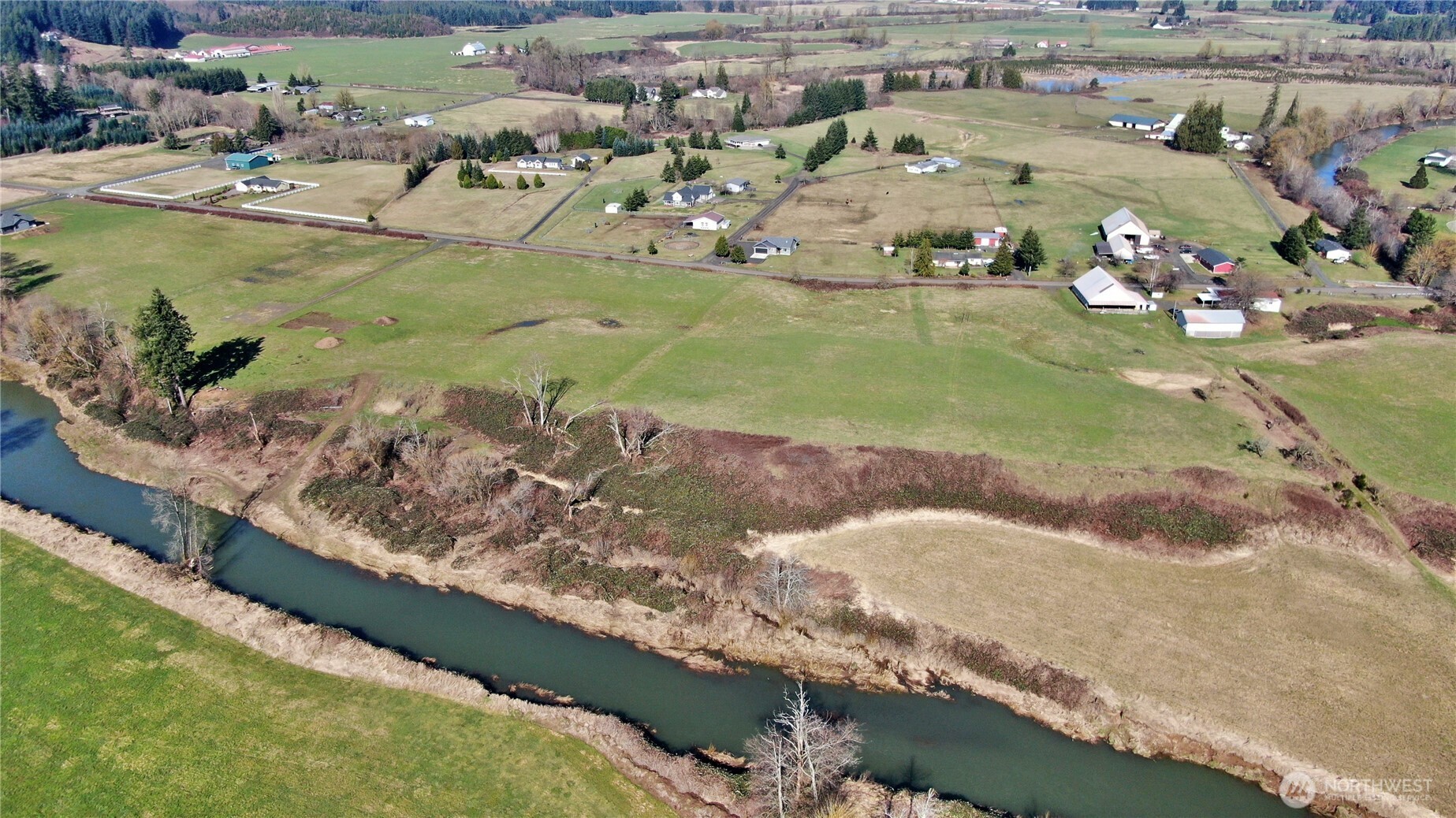 X1 Oxbow Road Raymond, WA 98577 - Photo 17 of 27 a view of a swimming pool with a lot of trees