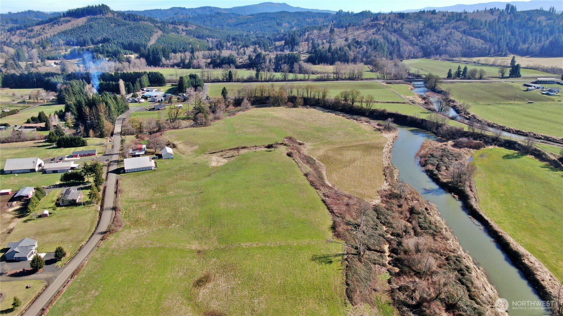 X1 Oxbow Road Raymond, WA 98577 - Photo 24 of 27 a view of a swimming pool and mountains in the background