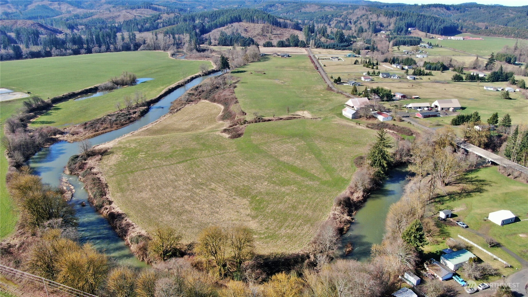 X1 Oxbow Road Raymond, WA 98577 - Photo 6 of 27 an aerial view of a house with a yard and lake view